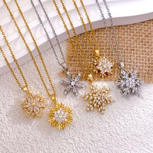 Drehbare Schneeflocken-Halskette in Gold und Silber aus Titanstahl mit Zirkonia-Kristallen