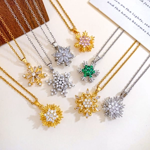 Rotierende Schneeflocken-Anhänger in Gold und Silber mit bunten Zirkonsteinen