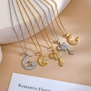 Elegant gold and silver moon and heart pendants with cubic zirconia on steel chains