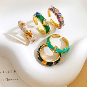 Adjustable enamel rings with flower patterns in vibrant colors and gold plating
