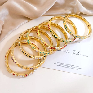 Bohemian 7-piece set of gold enamel flower bangles with sparkling zircon crystal inlays