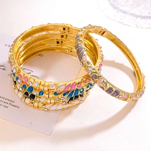 Vintage retro floral enamel bangle with crystals and hinge closure in gold finish