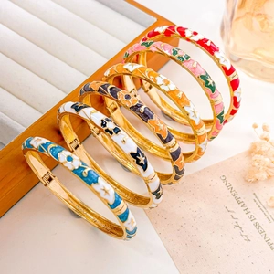 Set of six colorful enamel floral bangles with gold plating and spring opening
