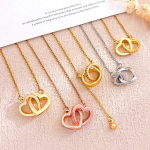 Ineinander verschlungene Herz- und Ringketten mit Zirkonia in Gold und Silber