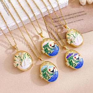 Elegant gold oval locket necklace set with colorful enamel cartoon swan and whale pendants