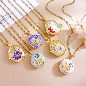 Enamel evil eye and floral pattern oval locket necklaces in gold stainless steel