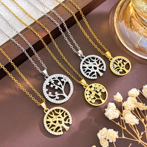 Gold and silver Tree of Life necklaces with cubic zirconia in a circular openwork design