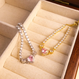 Adjustable heart tennis bracelet set with pink stones and sparkling zircons in wood box