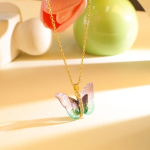 Elegant gold butterfly pendant necklace with purple and green gradient wings and zircons