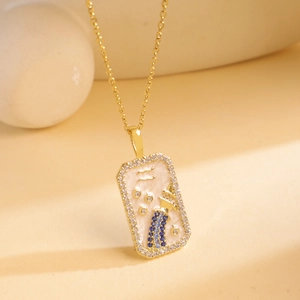 Gold rectangular Aquarius pendant necklace with blue stones and white enamel detail