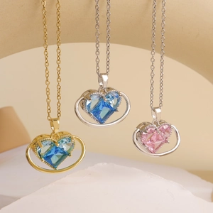 Elegant heart pendant necklaces with blue and pink gemstones in gold and silver finish