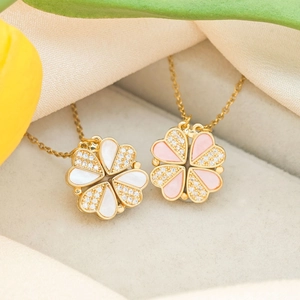 Golden heart clover pendant necklaces with crystal inlay in a velvet jewelry box