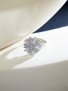 Macro shot of silver rotating flower ring with sparkling pave-set cubic zirconia
