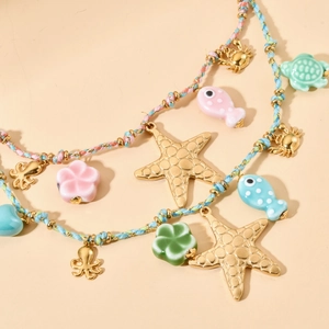 Colorful multilayered woven necklace with starfish and turtle ocean-themed pendants