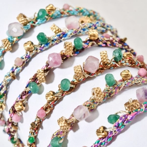 Handmade Bohemian woven bracelet featuring colorful natural stones and gold metal beads