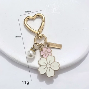 DIY heart hook flower keychain with white enamel petals, pearl and handmade tag