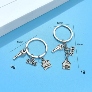 Detail view of 2026 house and key pendant keychain with precise dimensions and weight