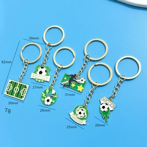 Set of six soccer world cup keychains with golden metal chains and enamel charms