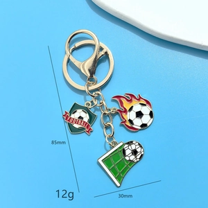 Soccer keychain set with flame ball and green shield pendant in gold-tone alloy plating