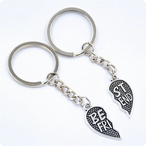 Macro detail of split heart keychain in antique silver with Best Friends engraving