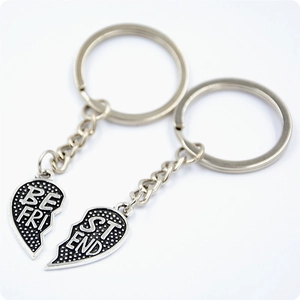 Polished silver heart puzzle keychains engraved with Best Friends for mother and daughter