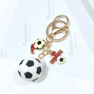 3D PVC soccer keychain with miniature football, red sneaker charm, and I Love Soccer tag