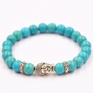 Pulsera étnica de cuentas azules con cabeza de Buda plateada y detalles de cristales
