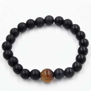Men's matte black beads bracelet featuring a natural brown tiger eye stone centerpiece