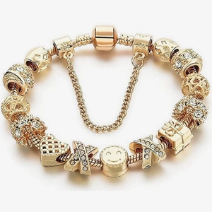 DIY gold snake chain bracelet with heart charms, smiley faces, and sparkling rhinestones