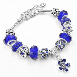 Silver snake chain bracelet with blue crystal beads and clover floral pendant charm
