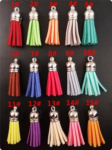 Detailed grid of 15 colorful suede tassels with silver caps for DIY keychain accessories