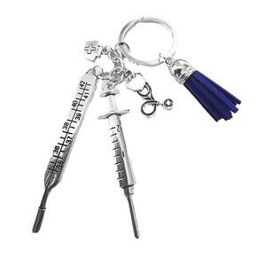 Medical theme keychain with syringe, thermometer, stethoscope, and blue tassel charms