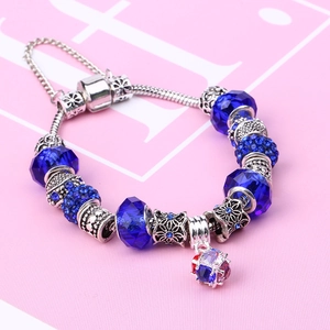 Silver snake chain bracelet with blue crystal beads and sparkling pave heart charm