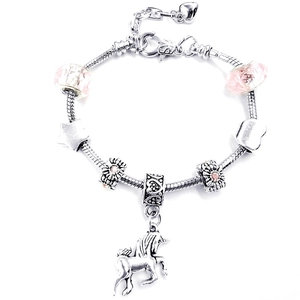 Detail of silver unicorn charm bracelet with pink crystal beads and snake chain