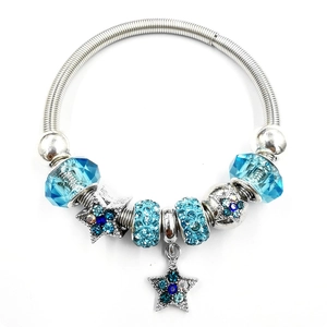 Silver bead bracelet with blue crystals and star charms on a flexible snake chain