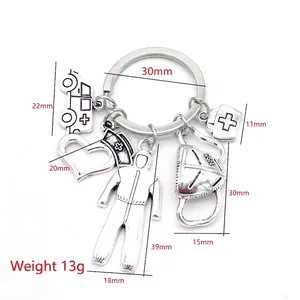 Silver alloy medical keychain featuring ambulance, nurse hat, and N95 mask pendants