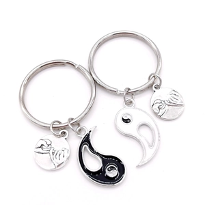 Pair of Tai Chi Yin Yang BFF keychains with Pinky Swear hand-holding embossed pendants