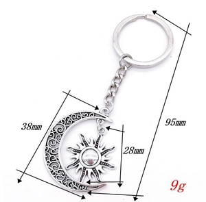 Detailed size specifications for silver celestial moon and sun pendant keychain
