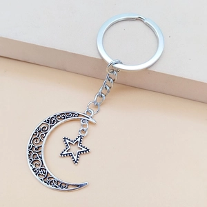 Vintage silver moon and star keychain with intricate filigree hollow design for women
