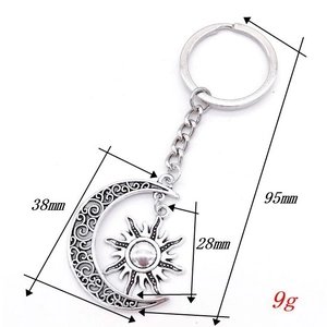 Vintage silver hollow moon and sun keychain pendant with 95mm total length dimensions