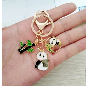 Golden panda bamboo keychain set with exquisite enamel charms and round pendant