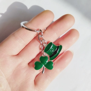 St. Patrick's Day keychain featuring a green shamrock and Irish hat charm with metal ring