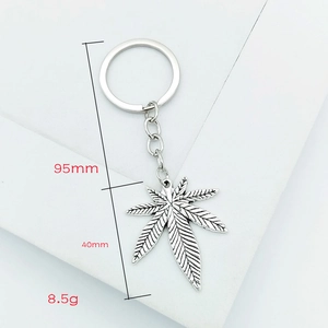 Silver metal keychain featuring a textured maple leaf pendant and 95mm total length