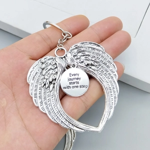Silver angel wings keychain with engraved round pendant and motivational quote