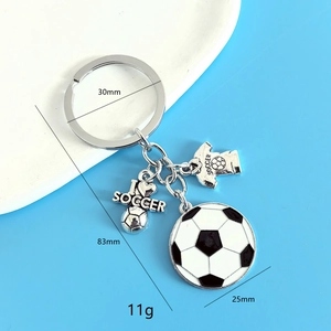 Detail view of soccer keychain with I LOVE SOCCER heart and black white ball pendant