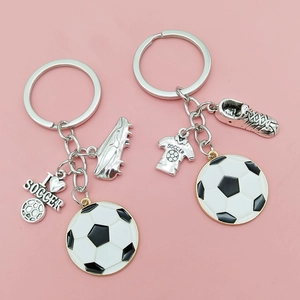 Soccer themed metal keychain set with mini football shoe and jersey pendants