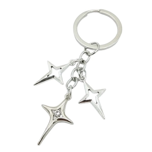 Silver metal star keychain with three North Star pendants and a sparkling central crystal