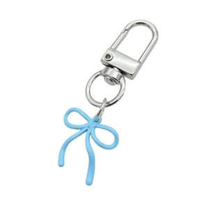 Light blue bow keychain pendant with silver lobster clasp on white background