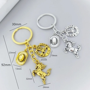 Western cowboy keychain set with horse, hat and horseshoe charms in gold and silver