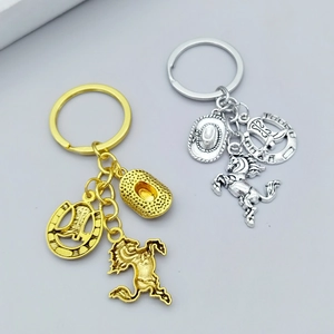 Western cowboy keychain set with horseshoe and cowboy hat charms in gold and silver finish
